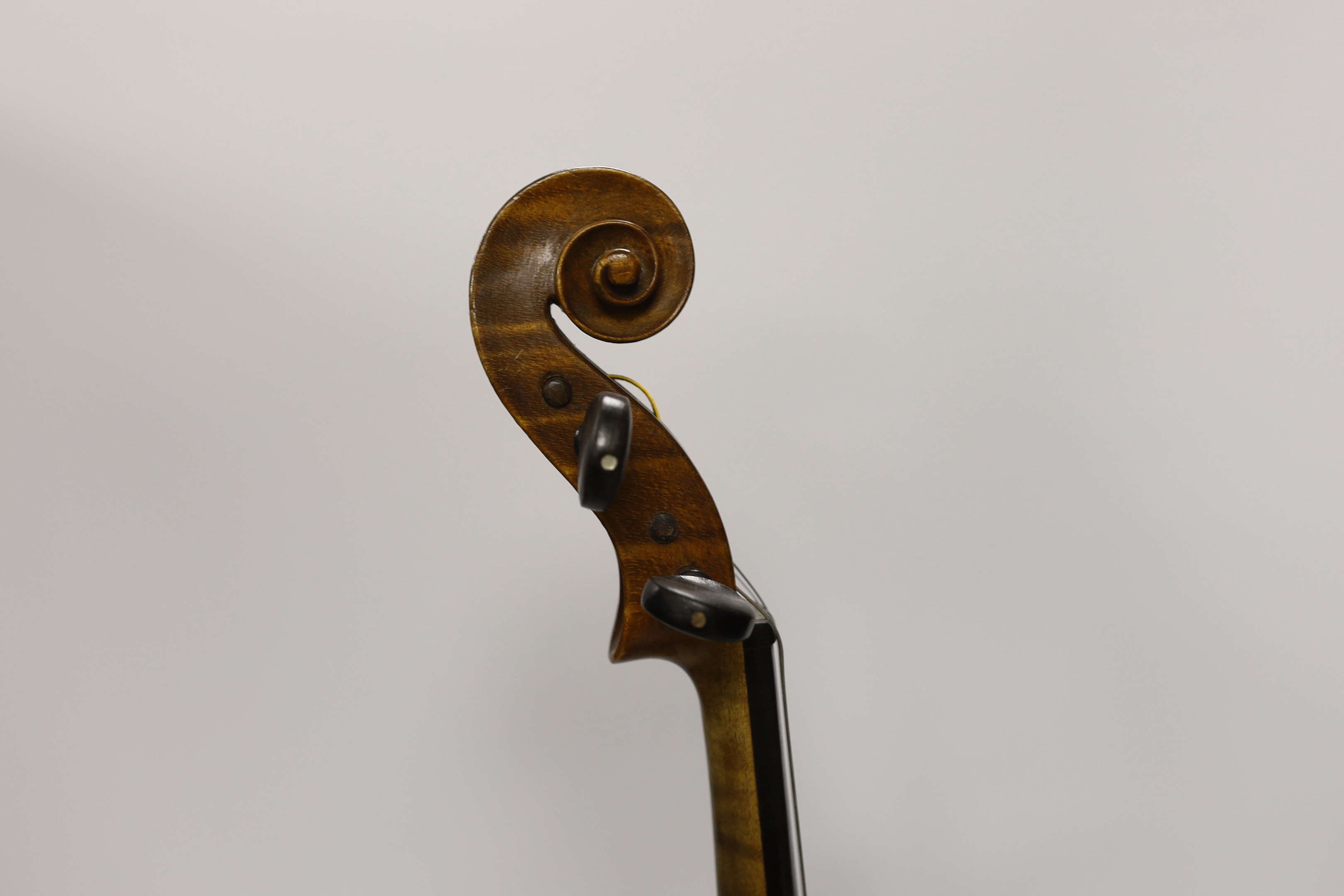 A cased early twentieth century violin by Rudolph Raymond, with maker’s label inside the body stating ‘made 1904’, body 36cm, in a good case with a label for W.E. Hills & Sons, Violin Makers, 140 New Bond St. London